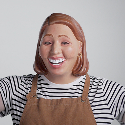 Photo of a woman with an apron on wearing a mask