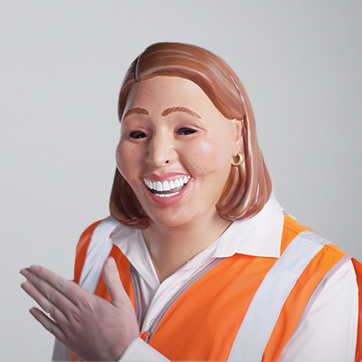 Photo of a woman with a high visibility vest on wearing a mask